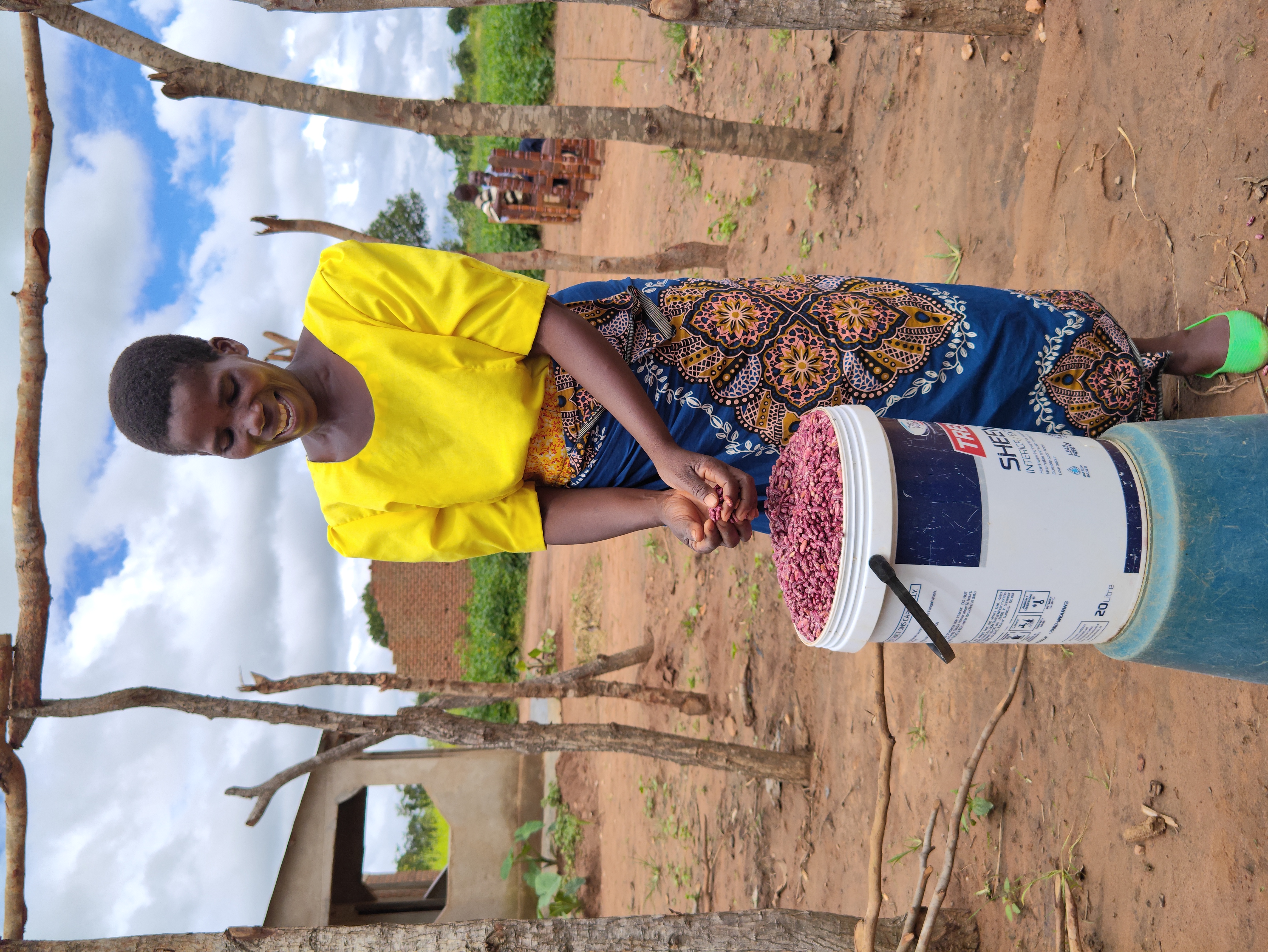 Esther Jere showing some of her NUA45 bean yields (3)